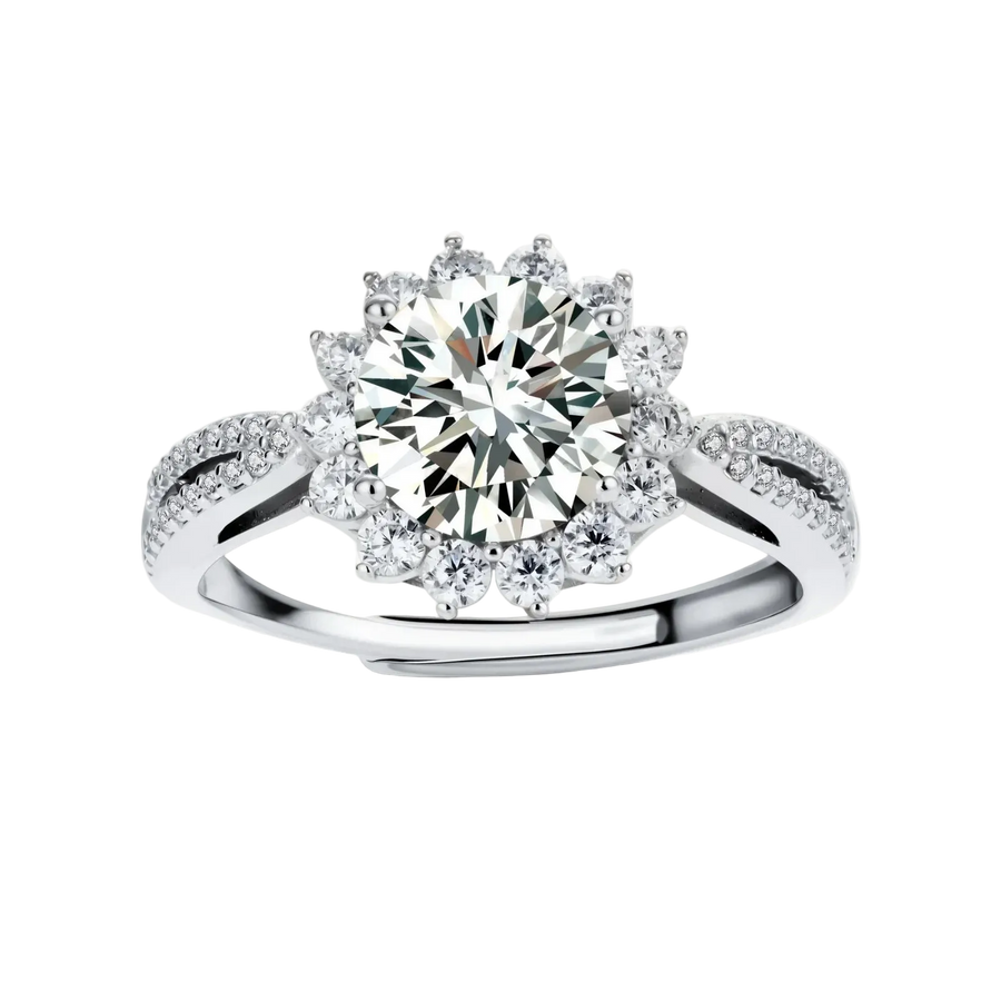 Close-up of sterling silver halo ring with brilliant round moissanite center stone surrounded by smaller accent stones