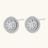 Double halo sterling silver stud earrings with brilliant round moissanite center stones and pavé crystal accents