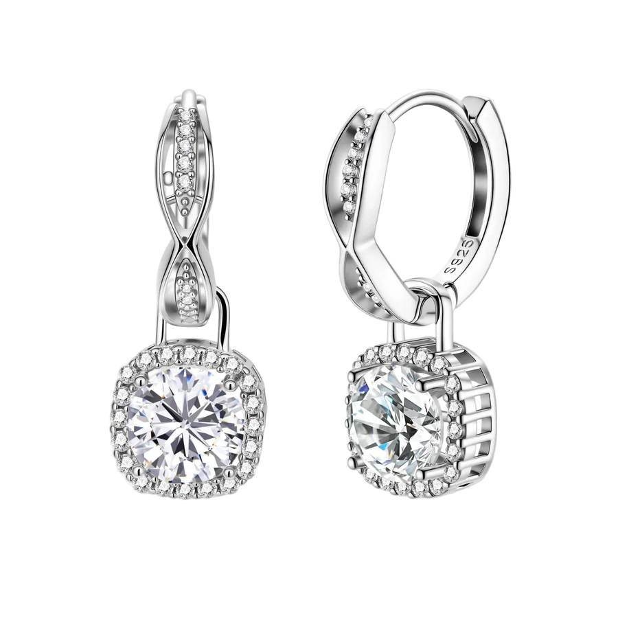 Sterling silver twisted hoop earrings with round moissanite stones in halo settings against neutral background.