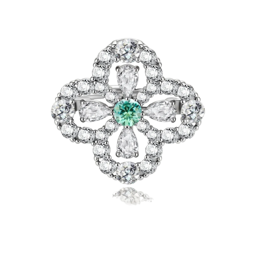 Sterling silver adjustable ring featuring four-leaf clover design with green center moissanite and clear accent stones