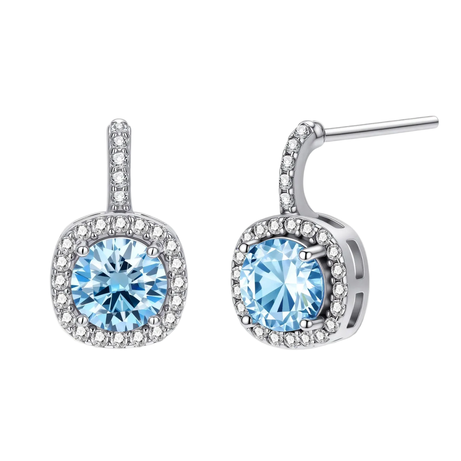 Sterling silver drop earrings featuring cushion-cut blue moissanite stones surrounded by sparkling halo settings