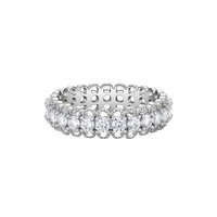 Sterling silver eternity ring with continuous row of brilliant moissanite stones in scalloped crown setting with milgrain detail