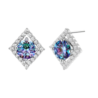 Diamond-shaped sterling silver stud earrings with rainbow moissanite centers surrounded by crystal halos