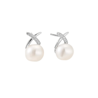 Rhodium-plated silver stud earrings with sparkling X design above lustrous round freshwater pearls on white background.