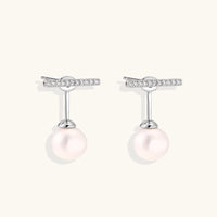 Rhodium-plated sterling silver ear jacket earrings with diamond-set horizontal bar and freshwater pearl drop