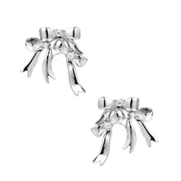 Sculptural bow earrings in polished white gold plate with sparkling zirconia stones and flowing ribbon details
