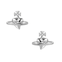 Polished white gold-plated Saturn planet stud earrings with orbital rings and crystal-centered cross on beige background