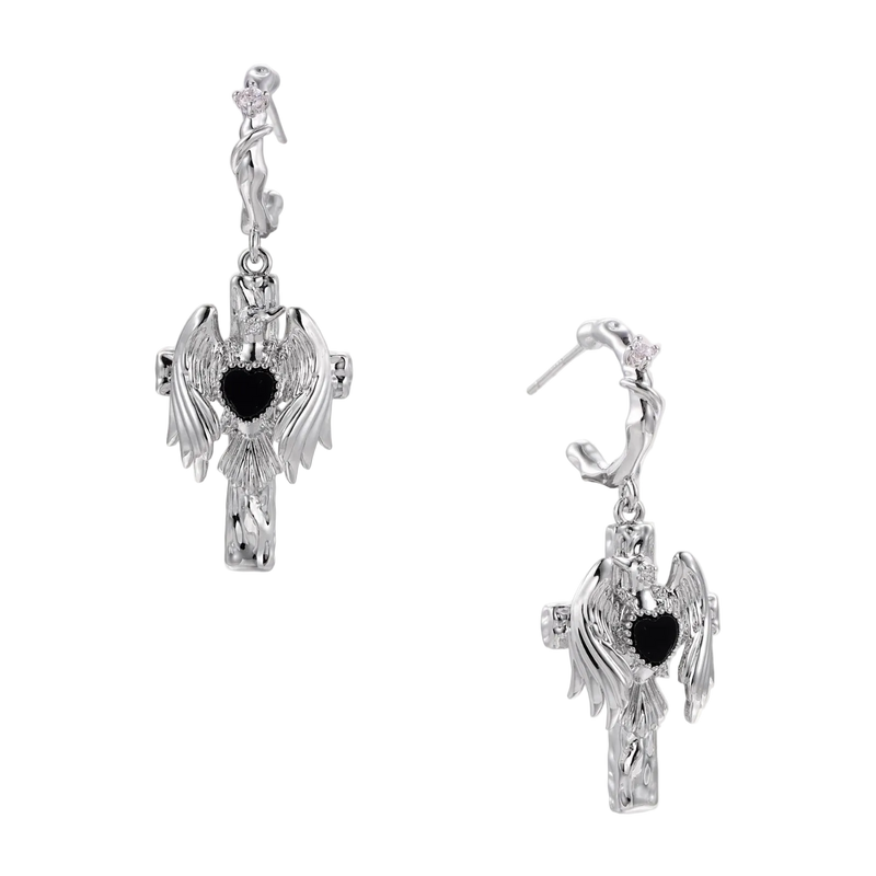 Silver-toned drop earrings with angel wings framing a black heart-shaped stone, white gold plated brass with S925 posts