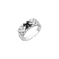 Adjustable white gold plated ring with geometric grid of black and clear zirconia stones in checkerboard pattern