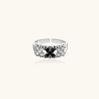 Adjustable white gold plated ring with geometric grid of black and clear zirconia stones in checkerboard pattern