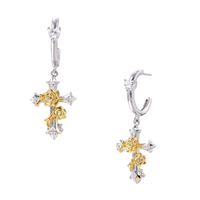 Two-tone huggie hoops with gold rose crosses and star zirconia accents on cream background