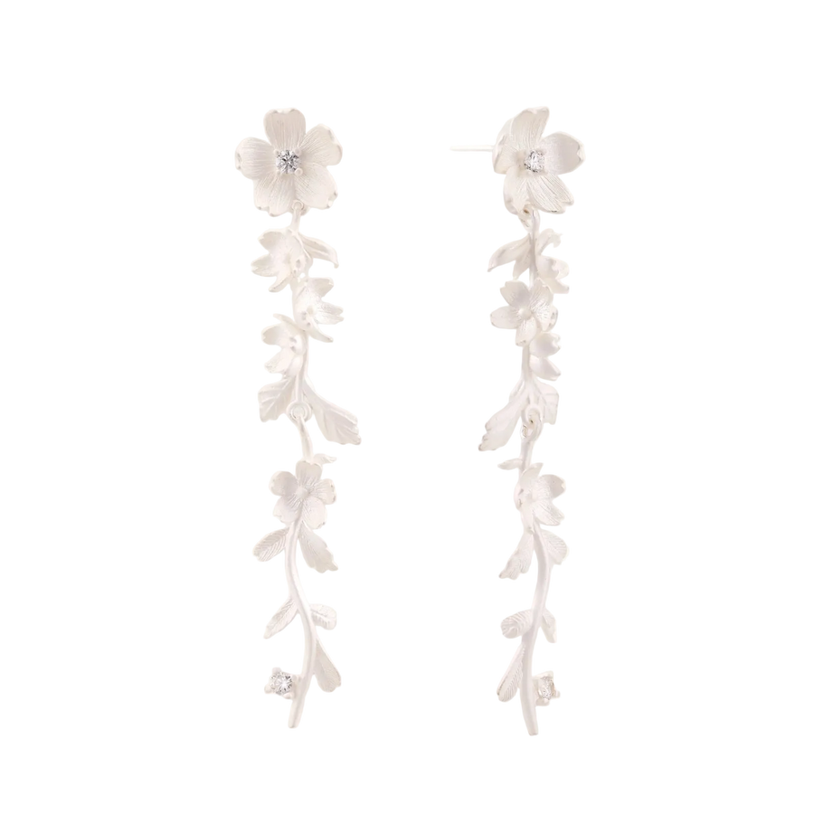 Long sterling silver drop earrings with delicate floral vine design and crystal accents on white background