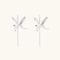 Delicate sterling silver dragonfly earrings with textured wings and curved threader hooks on white background