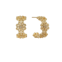 Gold hoop earrings with intricate three-dimensional floral filigree pattern in 14K gold plated brass on cream background