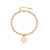 18K gold-plated oval bead bracelet with a four-leaf clover charm in mother-of-pearl or black enamel, adjustable lobster clasp, on white background.