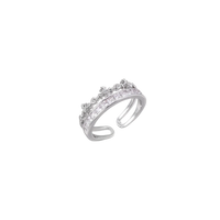 Silver-toned adjustable crown ring with channel-set square zirconia stones and delicate floral details on white background