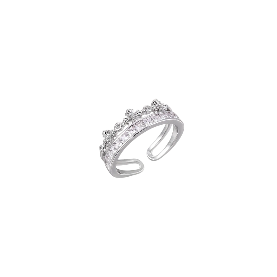 Silver-toned adjustable crown ring with channel-set square zirconia stones and delicate floral details on white background