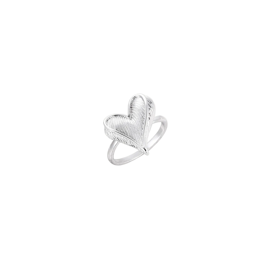 Silver ring with 3D heart formed by textured feather-like elements, white gold plated eco-brass on neutral background.