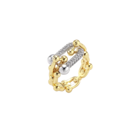 Triple-band gold ring with spherical bead chains and two crystal-pavé bars on cream background