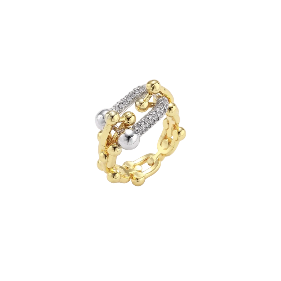 Triple-band gold ring with spherical bead chains and two crystal-pavé bars on cream background