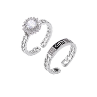 Two adjustable white gold plated rings with chain-link bands, featuring cubic zirconia halo and enamel details