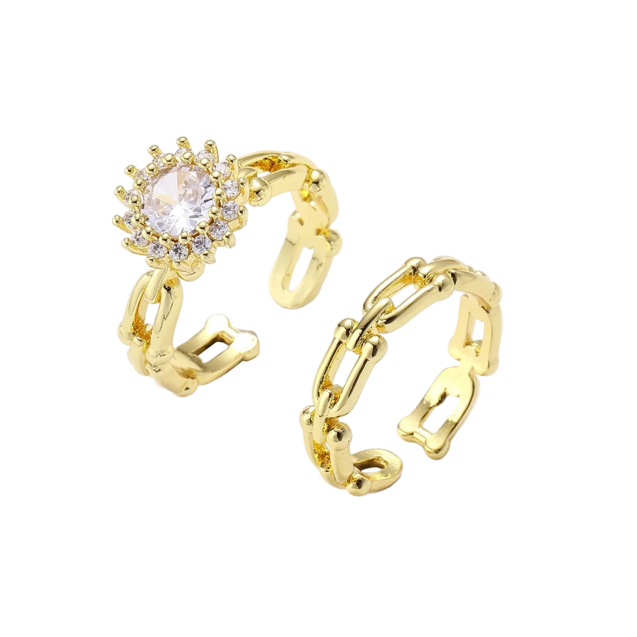 Two adjustable gold rings: chain-link band and halo-style ring with cubic zirconia stones on cream background