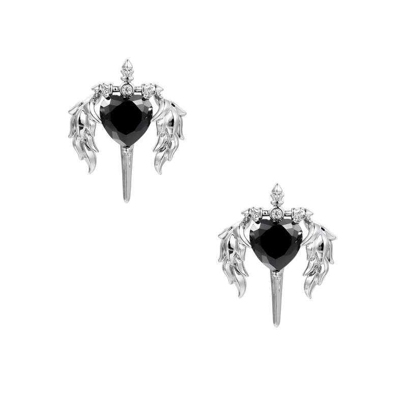 Silver drop earrings with twisted hoops and angel wings embracing black heart locket on white background.