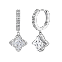 Sterling silver huggie hoops with geometric diamond-shaped moissanite dangles featuring pavé crystal details