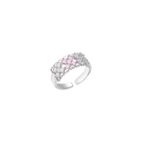 Close-up of an adjustable white gold plated ring featuring a cluster of square-cut clear and pink zirconia stones in geometric arrangement.