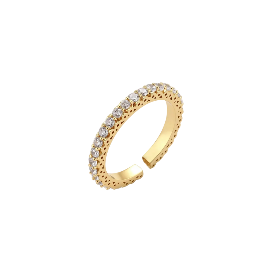 Close-up of adjustable gold-plated ring with continuous row of round zirconia stones on neutral background.